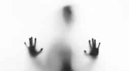 person behind fog glass